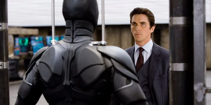 Bruce-Wayne-looking-at-the-bat-suit-in-The-Dark-Knight-legadodadc.webp